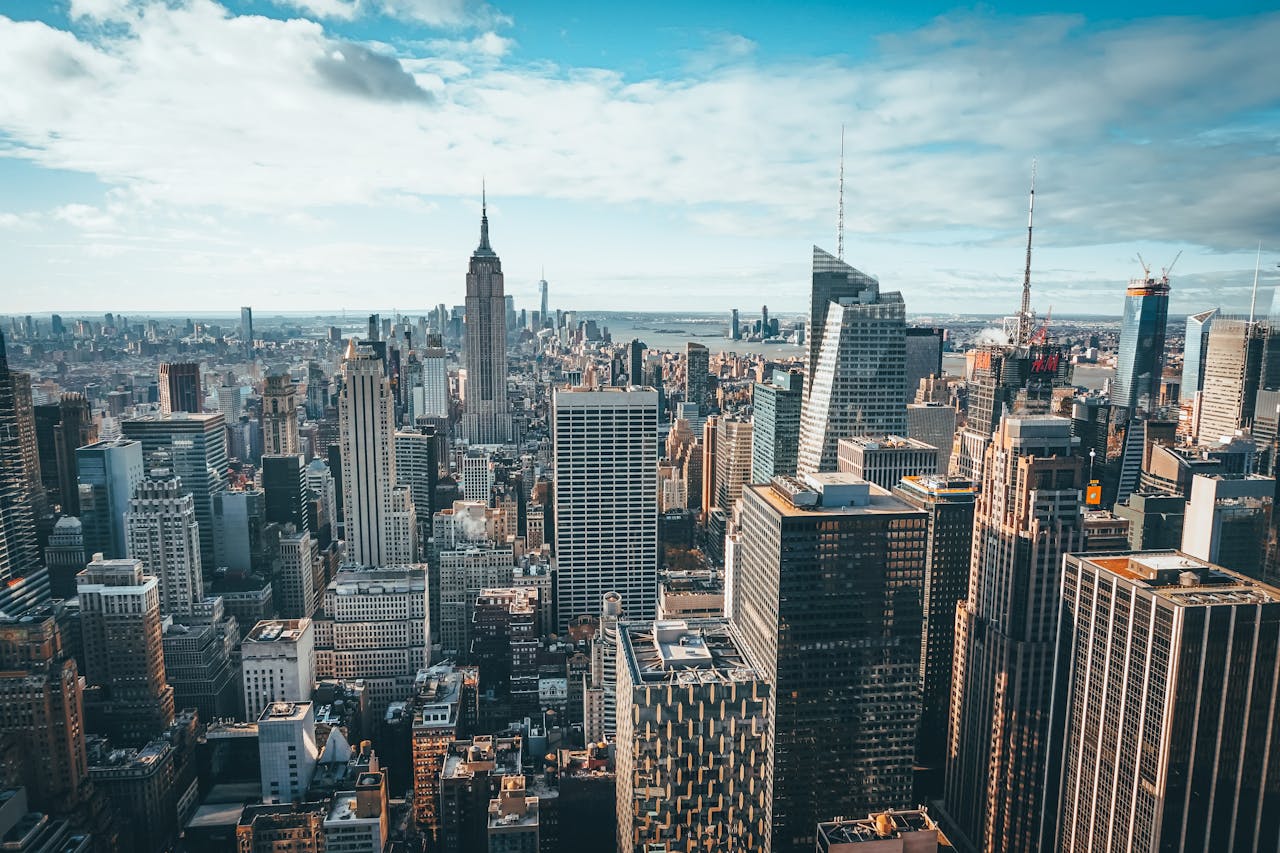 Stunning aerial view of New York City skyline featuring the iconic Empire State Building and skyscrapers.